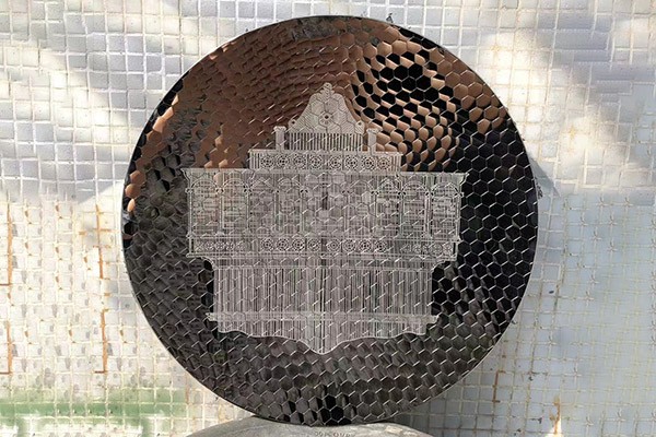 Custom Round Stainless Steel Wall Sculpture with Laser-Etched Landmark Design